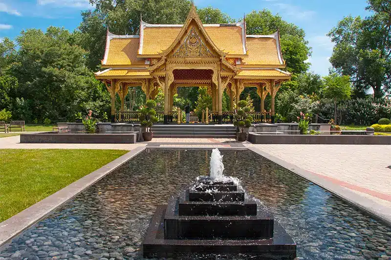 The ornate Thai Pavilion and reflecting pool at Olbrich Botanical Gardens, a must-see attraction located near The Buckingham Inn in Madison, WI.