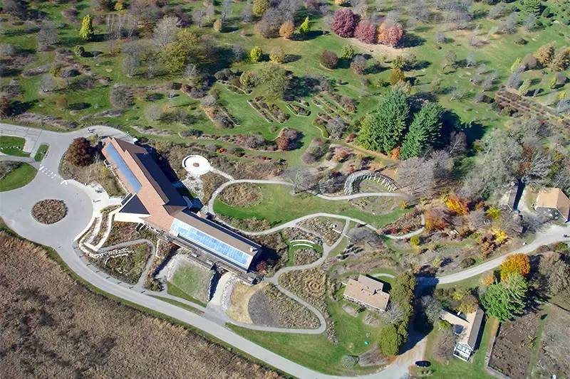 Aerial view of the UW–Madison Arboretum's visitor center and expansive gardens, a top nature destination for guests staying at our Madison bed and breakfast.